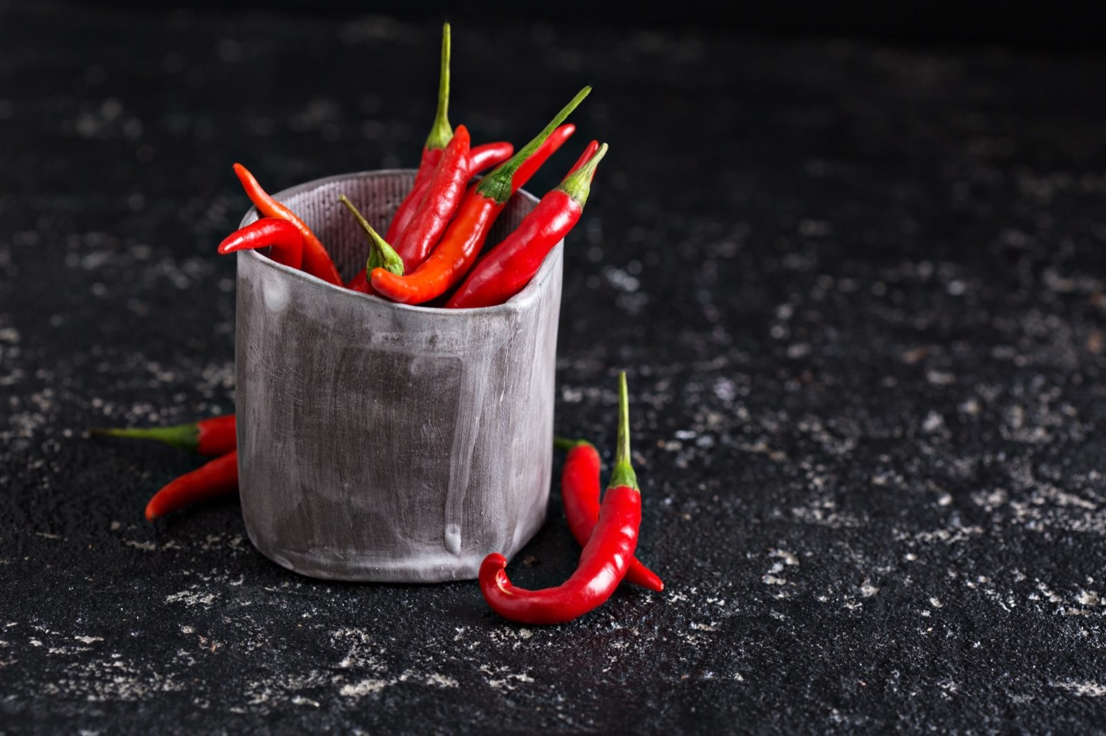 Red cayenne chillies in a rustic container