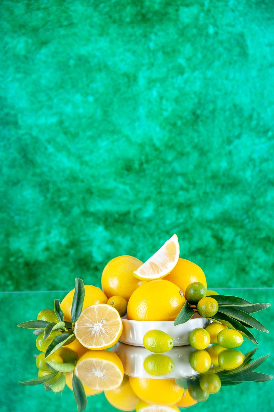 Lemons and kumquats with green leaves
